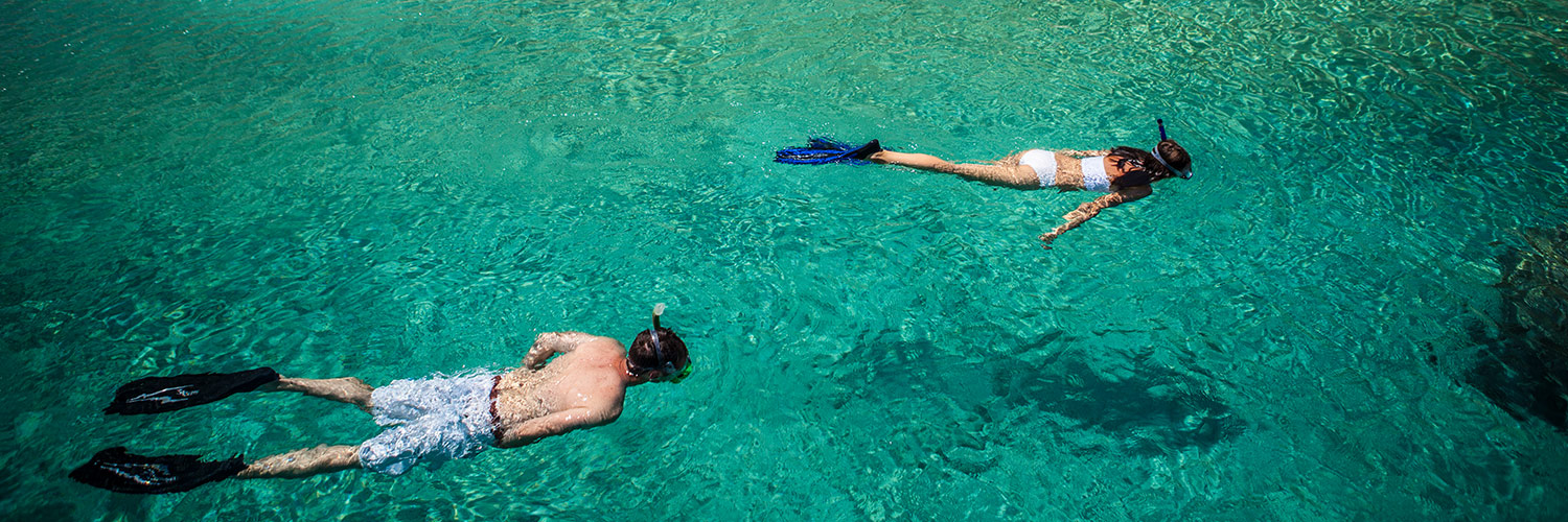 Guest snorkeling of a rented motorized dinghies on Lizard Island