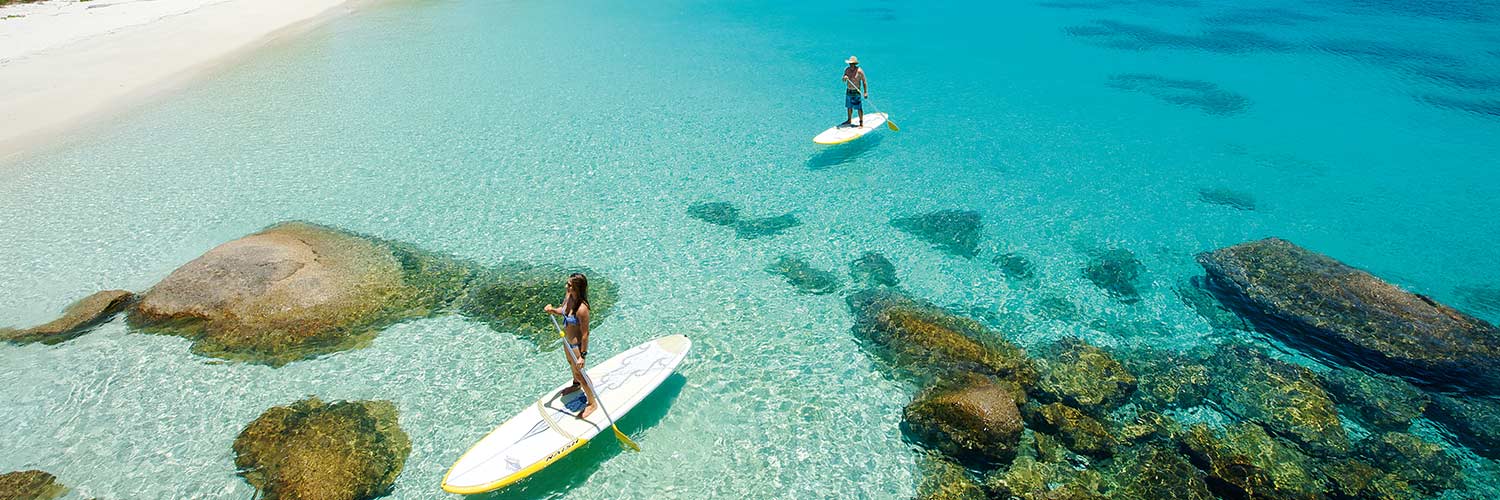 Guest paddle boarding on Anchor Bay, Lizard Island