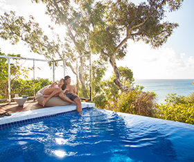 Guest relaxing at in their Villa pool